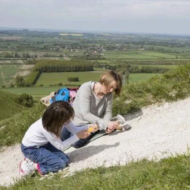 Volunteers hard at work during a Scouring of the White Horse event, carefully restoring the chalk figure to preserve its brilliance.