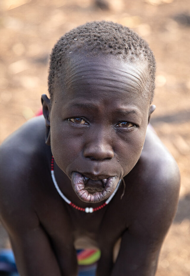 Women typically choose when to wear their lip plates, leaving them off for most of the day as part of their daily routine. (Credit: Jayne Mclean) 