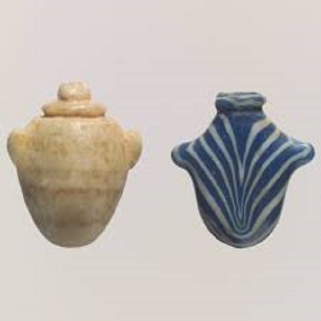 Agate and glass "ib" amulets, crafted between 1550 and 1186 B.C., exemplify the artistic and spiritual practices of ancient Egypt.