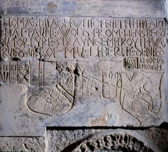 Another Beauchamp Tower inscription, signed “Thomas Miagh 1581,” reads: “THOMAS MIAGH – WHICH LETH HERE THAT FAYNE WOLD FROM HENS BE GON BY TORTURE STRAUNGE MI TROUTH WAS TRYED YET OF MY LIBERTY DENIED.” Though never tried, he remained locked up until 1583 but was granted “the liberty of the Tower,” allowing him some freedom within its precincts.